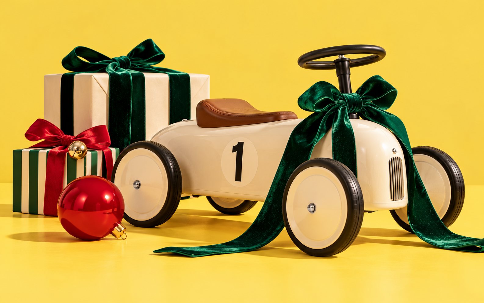 Brown-paper gift parcels tied with red string beside a stamped case folder and a sprig of fir