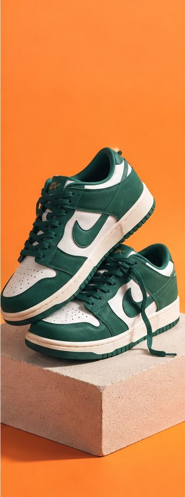 Green and white sneakers on a pedestal